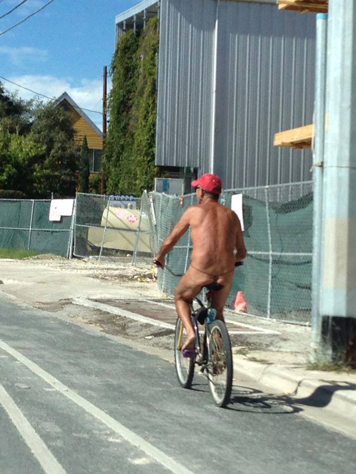 nude man on bike