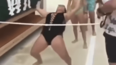 womens bikini rips while limbo