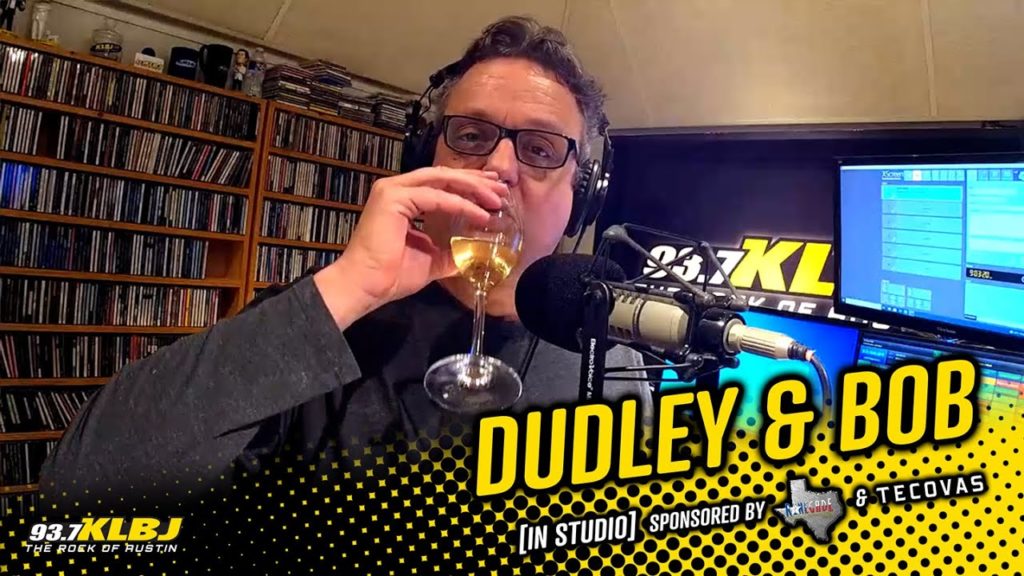 Dale drink wine in the KLBJ FM studio.