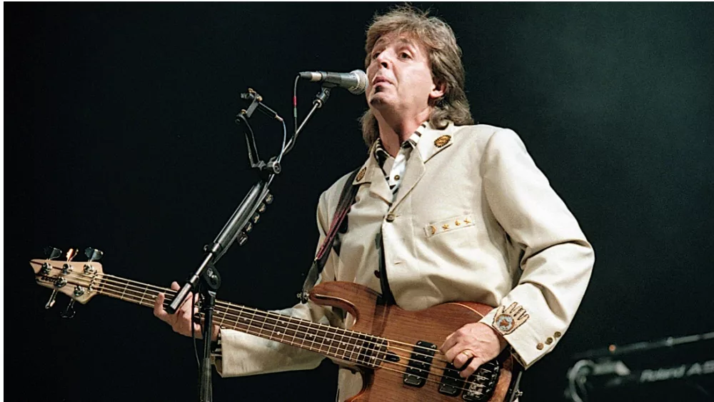 Paul McCartney performs at the Fourth of July concert in the Robert F. Kennedy football stadium. Washington DC. USA^ 4th July^ 1990