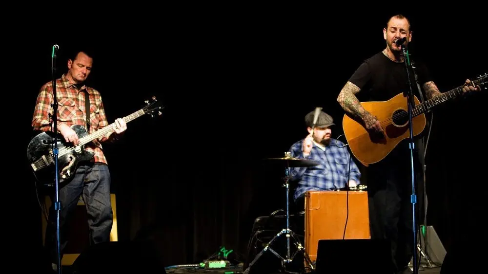 Mike Ness of rock band Social Distortion sings and plays guitar on stage at the Crocodile in Seattle on February 13^ 2011.