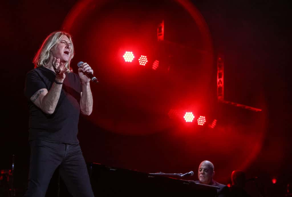 Joe Elliott of Def Leppard performs 'Pour Some Sugar On Me' with Billy Joel at Fenway Park in Boston, Massachusetts.