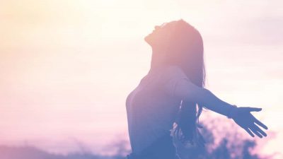 This is an image of a young woman relaxing in the sun