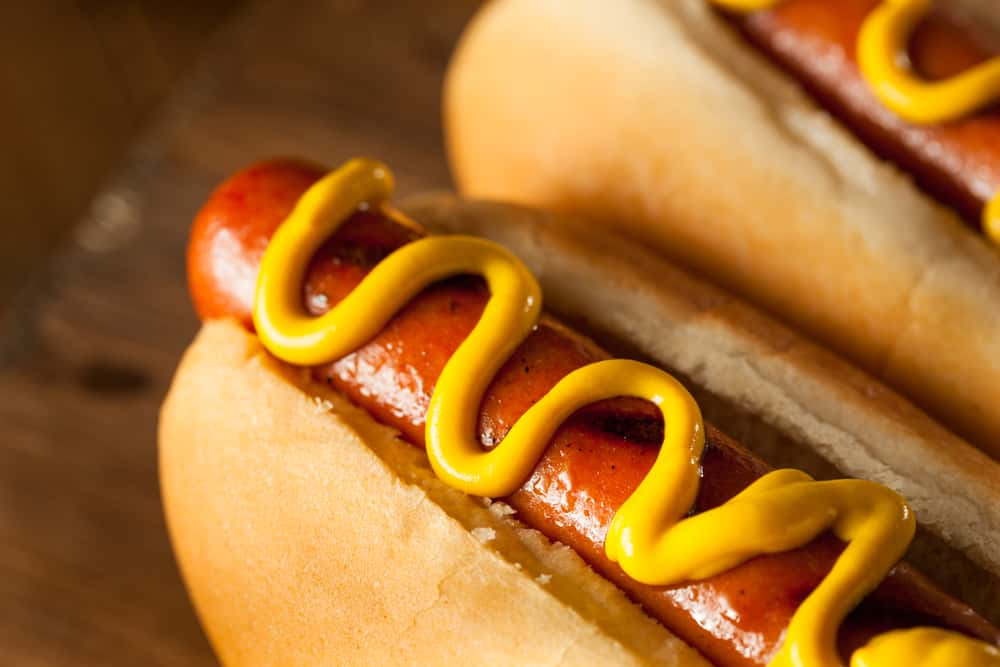 Find out where to celebrate National Hot Dog Day and get $1 deals on food!