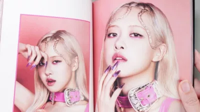 BlackPink BORN PINK 2nd Album photobook featuring member ROSE with x on grey. Pink music CD in player.