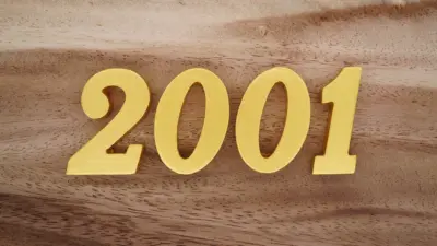 goldenarabicnumerals2001onadarkbrowntowhite