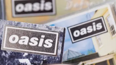 London^ UK - August 27 2024: Oasis band cds. Oasis are a popular rock band from the 1990's britpop era