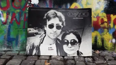 The Lennon Wall since the 1980s is filled with John Lennon-inspired graffiti and pieces of lyrics from Beatles. PRAGUE^ CZECH REPUBLIC - DECEMBER 15