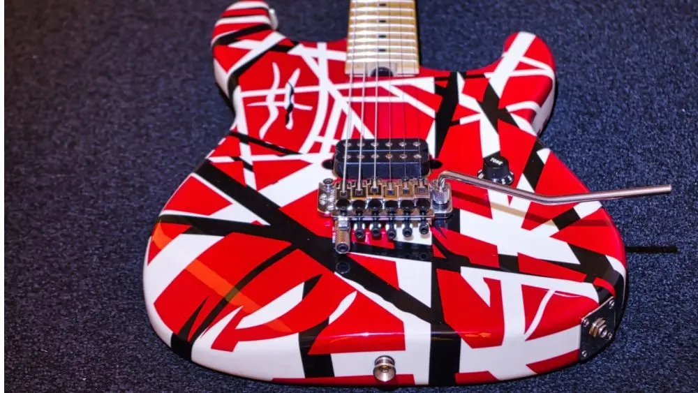 Eddie Van Halen's striped red white black guitar body on a black carpet Hannover^ Germany - December^ 2018