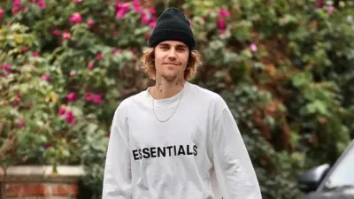 Justin Bieber enjoys a walk around his neighborhood. Los Angeles^ CA USA 02 27 2021