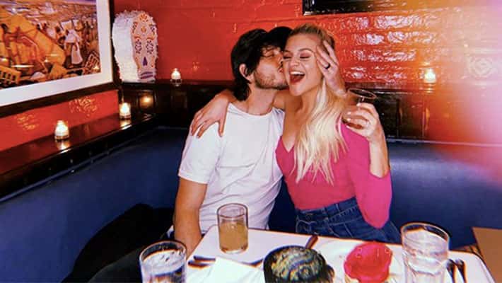 Morgan Evans kissing Kelsea Ballerini on the cheek