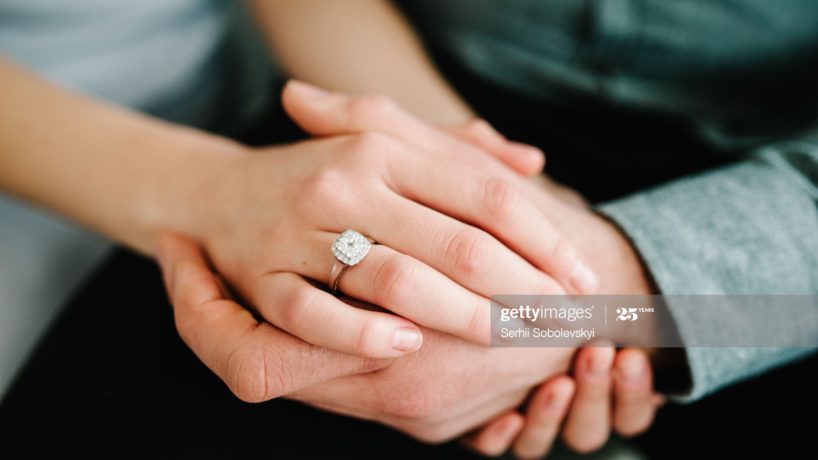 Couple holding hands