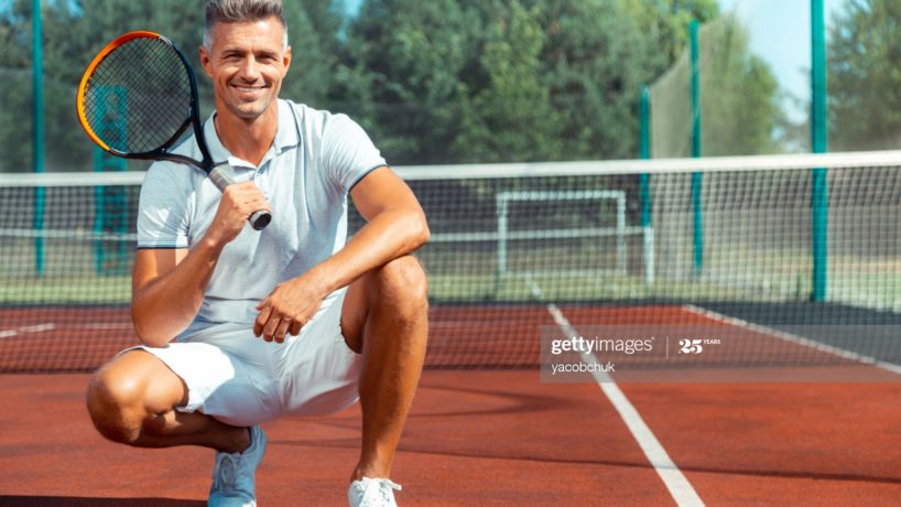 Man holding tennis racket