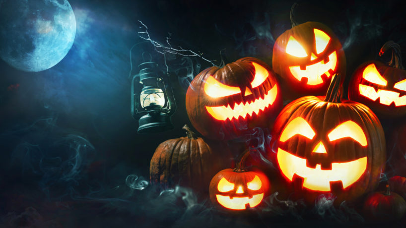 Halloween pumpkin head jack lantern with burning candles