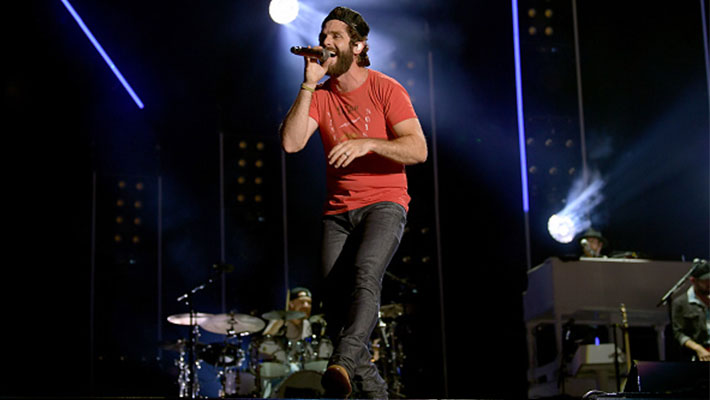 Thomas Rhett performing on stage