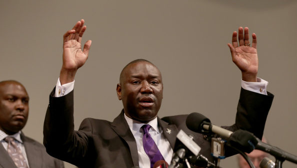 ST LOUIS, MO - AUGUST 18: The family attorney for Michael Brown, Benjamin Crump, raises his hands and speaks during a press conference where Michael Baden, a medical examiner who carried out an autopsy of the 18 year old teenager announced his findings at the Greater St. Marks Family Church on August 18, 2014 in Ferguson, Missouri. Unarmed teenager Michael Brown was shot and killed by a Ferguson police officer on August 9th.