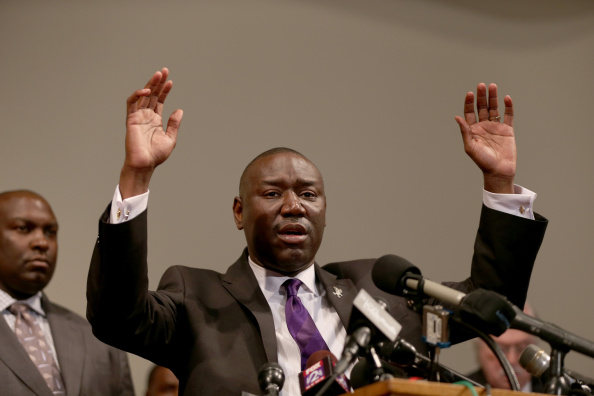 ST LOUIS, MO - AUGUST 18: The family attorney for Michael Brown, Benjamin Crump, raises his hands and speaks during a press conference where Michael Baden, a medical examiner who carried out an autopsy of the 18 year old teenager announced his findings at the Greater St. Marks Family Church on August 18, 2014 in Ferguson, Missouri. Unarmed teenager Michael Brown was shot and killed by a Ferguson police officer on August 9th.