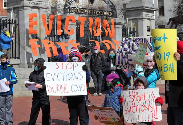 People and students from Worker's Circle of Boston and members of City Life Vida Urbana protest to rally support behind house bill HD3030, which seeks to stop evictions during the ongoing coronavirus pandemic, at the Massachusetts State House in Boston on March 14, 2021.