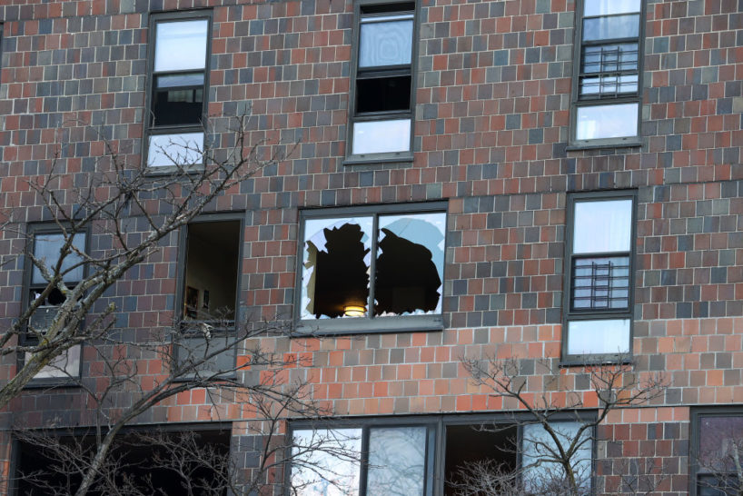 BRONX, NEW YORK - JANUARY 10: Apartment building is seen after deadly fire in Bronx of New York City, United States on January 10, 2022. - 17 people have died and dozens are injured after a fire tore through a high-rise apartment building in the New York borough of the Bronx. Mayor Eric Adams revised the death toll Monday down from 19, saying it was an evolving situation.