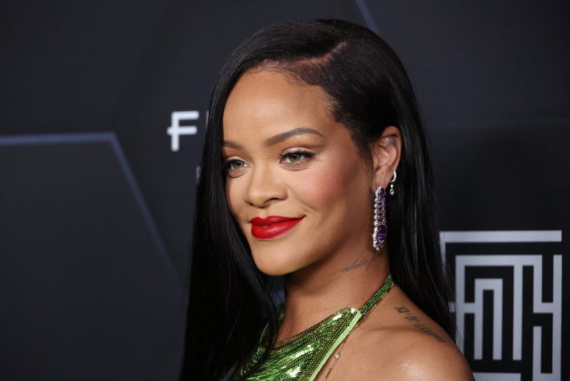 LOS ANGELES, CALIFORNIA - FEBRUARY 11: Rihanna poses for a picture as she celebrates her beauty brands fenty beauty and fenty skin at Goya Studios on February 11, 2022 in Los Angeles, California.