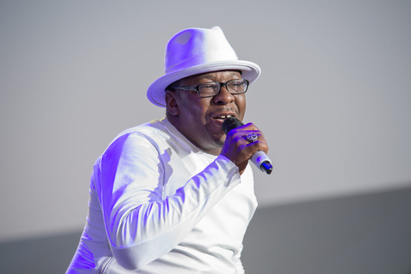Bobby Brown wearing white on stage