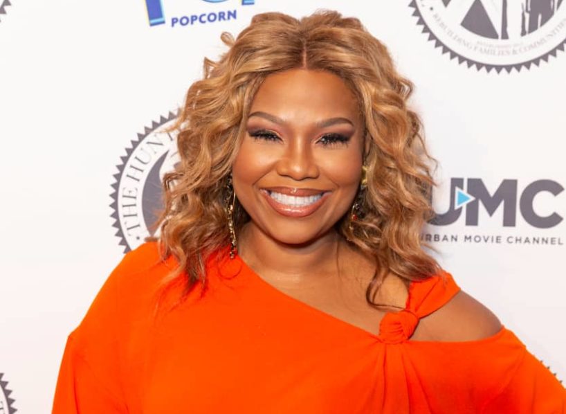 Mona Scott Young wearing red