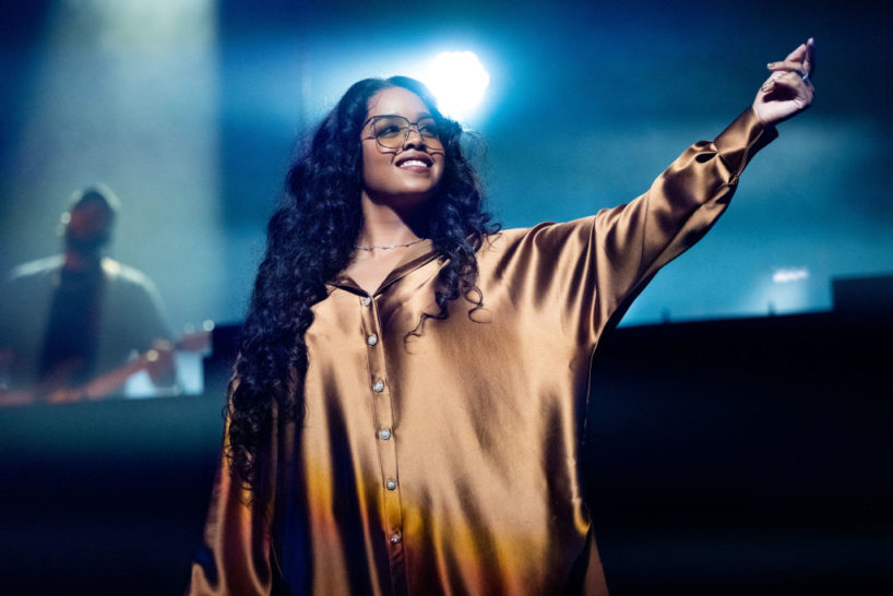 INGLEWOOD, CALIFORNIA - APRIL 05: Musician H.E.R. performs onstage during the 'Back of Your Mind Tour' at YouTube Theater on April 05, 2022 in Inglewood, California.