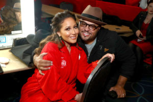 NEW YORK, NY - FEBRUARY 08: Actor Adrienne Houghton (L) and Israel Houghton pose backstage at the American Heart Association's Go Red For Women Red Dress Collection 2018 presented by Macy's at Hammerstein Ballroom on February 8, 2018 in New York City.