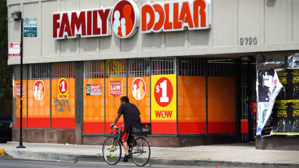 CHICAGO, ILLINOIS - AUGUST 02: A cyclist rides past a Family Dollar store in the Humboldt Park neighborhood on August 02, 2022 in Chicago, Illinois. Discount stores have seen a double digit increase in business as higher income shoppers look to the stores for a hedge against inflation that continues to chip away at their buying power.