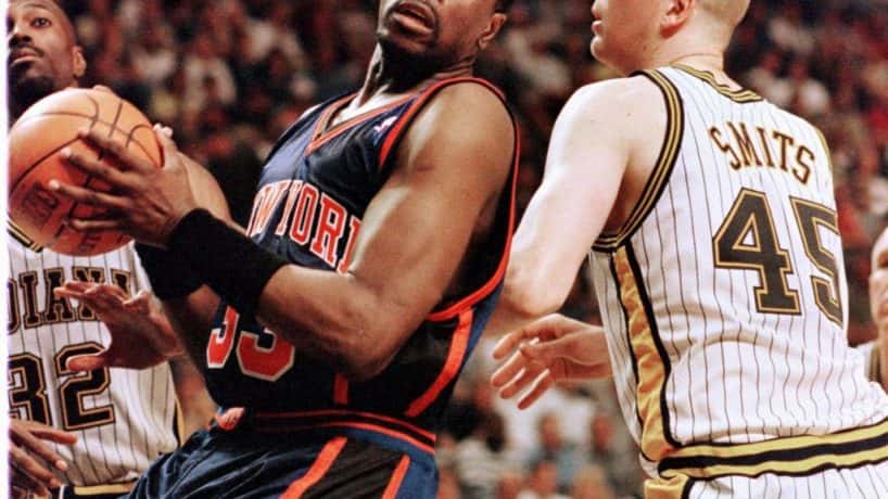 Patrick Ewing (L) of the New York Knicks works into position against Rik Smits (R) of the Indiana Pacers 07 May