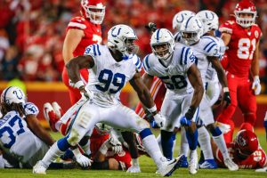 Colts defensive end Justin Houston reacts after a sack in 2019