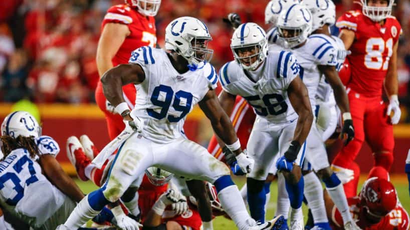 Colts defensive end Justin Houston reacts after a sack in 2019