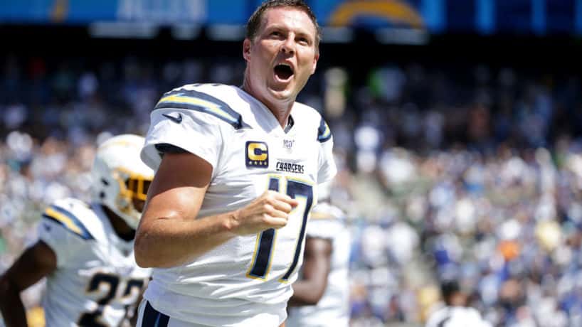 Former Chargers QB Philip Rivers pumps his fist during a 2019 game.