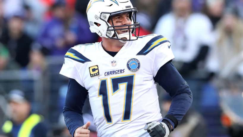 Former Chargers quarterback Philip Rivers jogs off the field in 2019.