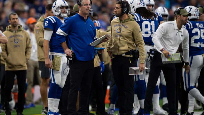 Colts offensive coordinator Nick Sirianni talks to Frank Reich during a game.