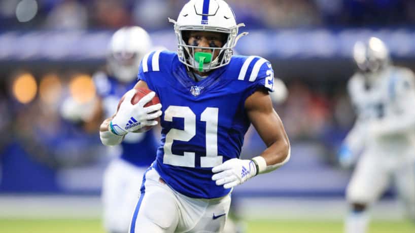 Nyheim Hines #21 of the Indianapolis Colts returns a punt for a touchdown against the Carolina Panthers at Lucas Oil Stadium