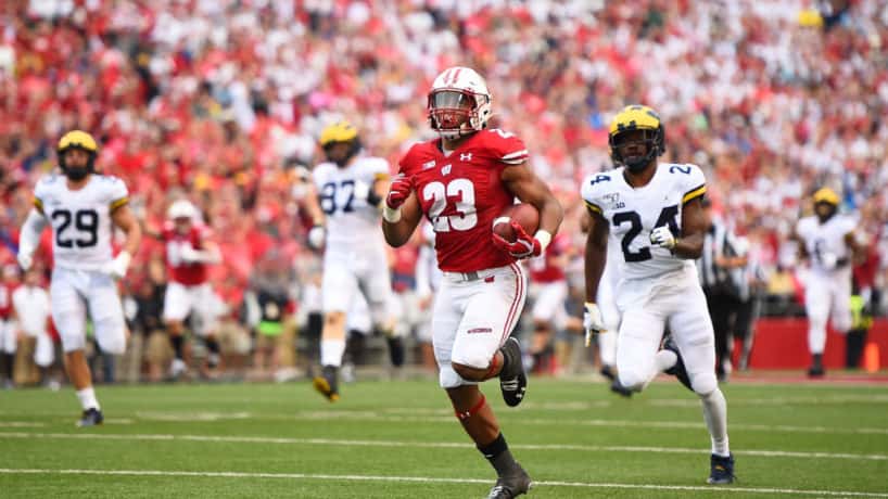 Wisconsin running back Jonathan Taylor runs in the open field.