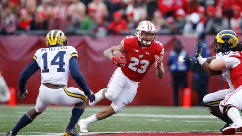 Wisconsin running back Jonathan Taylor runs against Michigan.