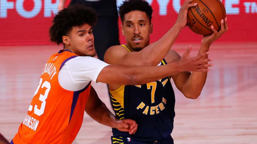 Pacers guard Malcolm Brogdon tries to pass against the Suns.