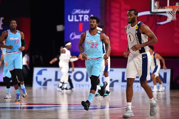 Heat forward Jimmy Butler walks back down the court against the Pacers.