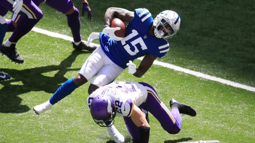 Colts wideout Parris Campbell gets hit by Vikings safety Harrison Smith.