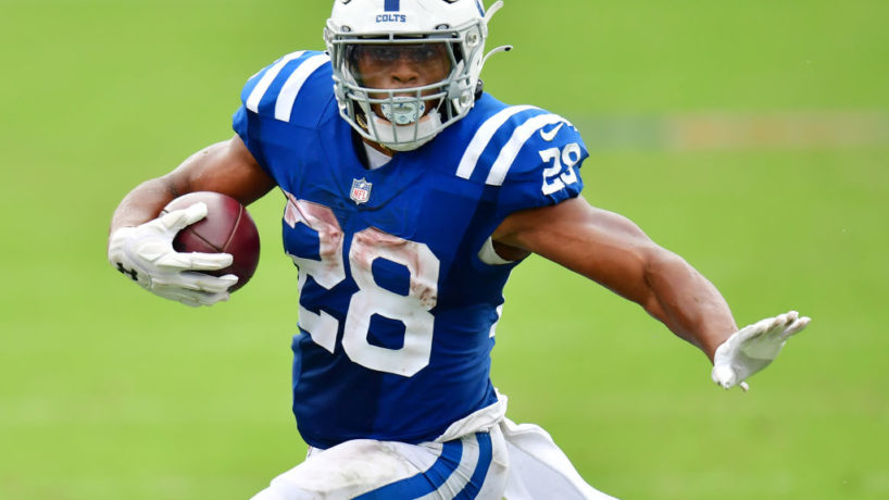 Colts running back Jonathan Taylor runs in the open field.