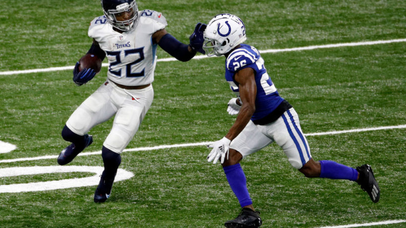 Titans RB-Derrick Henry stiffarms Rock Ya-Sin.