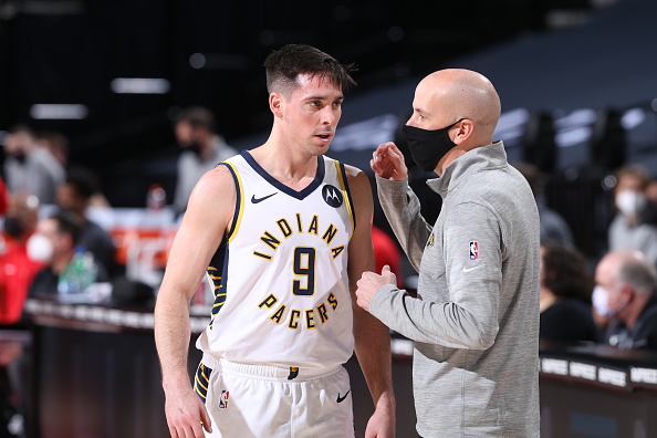Pacers guard T.J. McConnell talks to Nate Bjorkgren during a win over Portland.