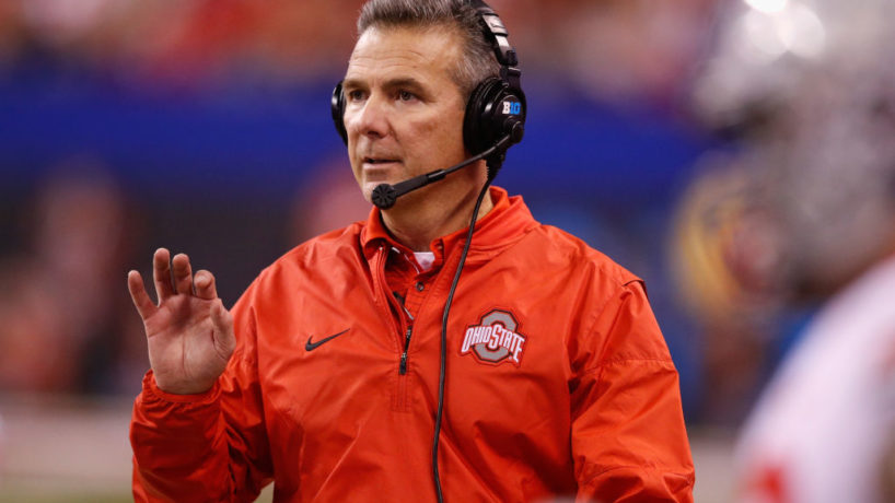 Urban Meyer coaches in the Big Ten Championship at Lucas Oil Stadium with his headset on