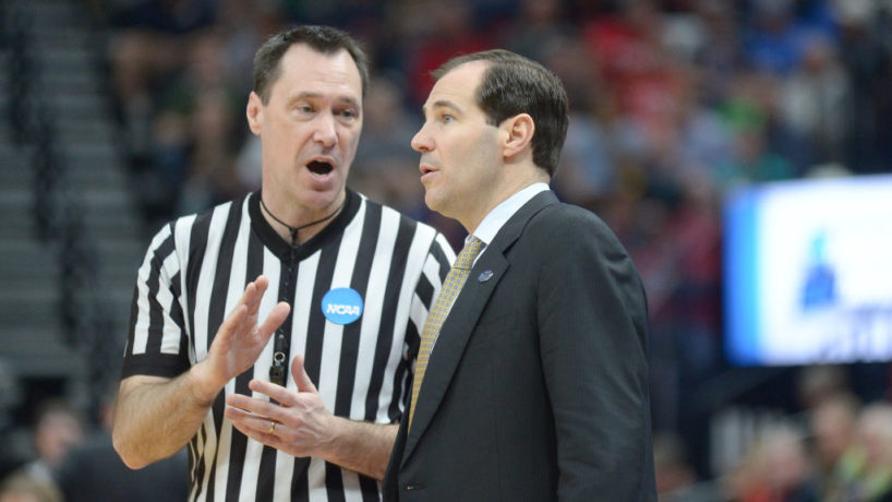 Scott Drew talks to a NCAA referee on the sideline in Baylor's matchup with Gonzaga