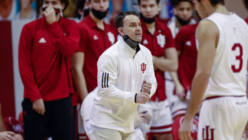 Archie Miller shouts instructions from the Indiana sideline with his bench players behind him