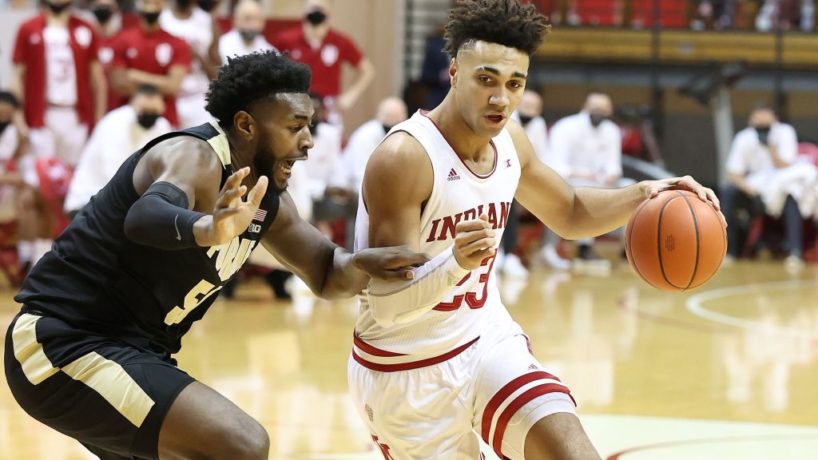 Trevion Williams defends Trayce Jackson-Davis as he drives to the bucket inside Assembly Hall
