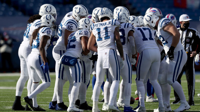 The Colts huddle before a play.