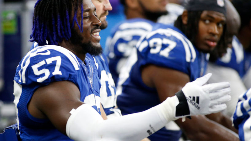Colts DE-Kemoko Turay talks on the bench.